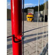 Holders for barricade panels on panel fences for building sites